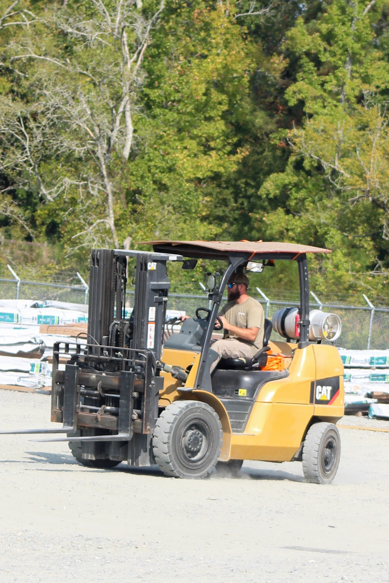 Dallas operating a CAT forklift in the Best Builders Supply yard