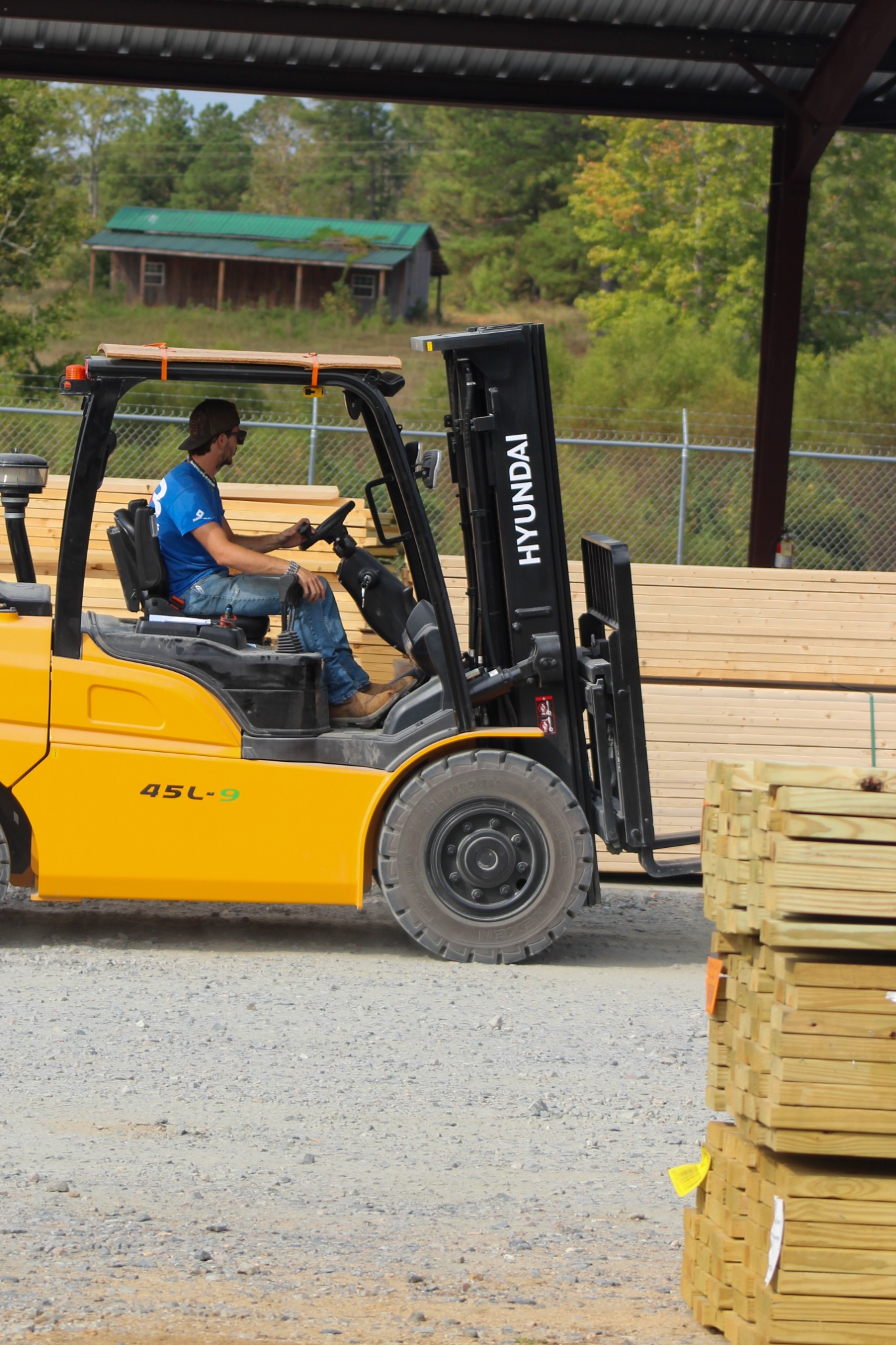 Team member operating a Hyundai forklift