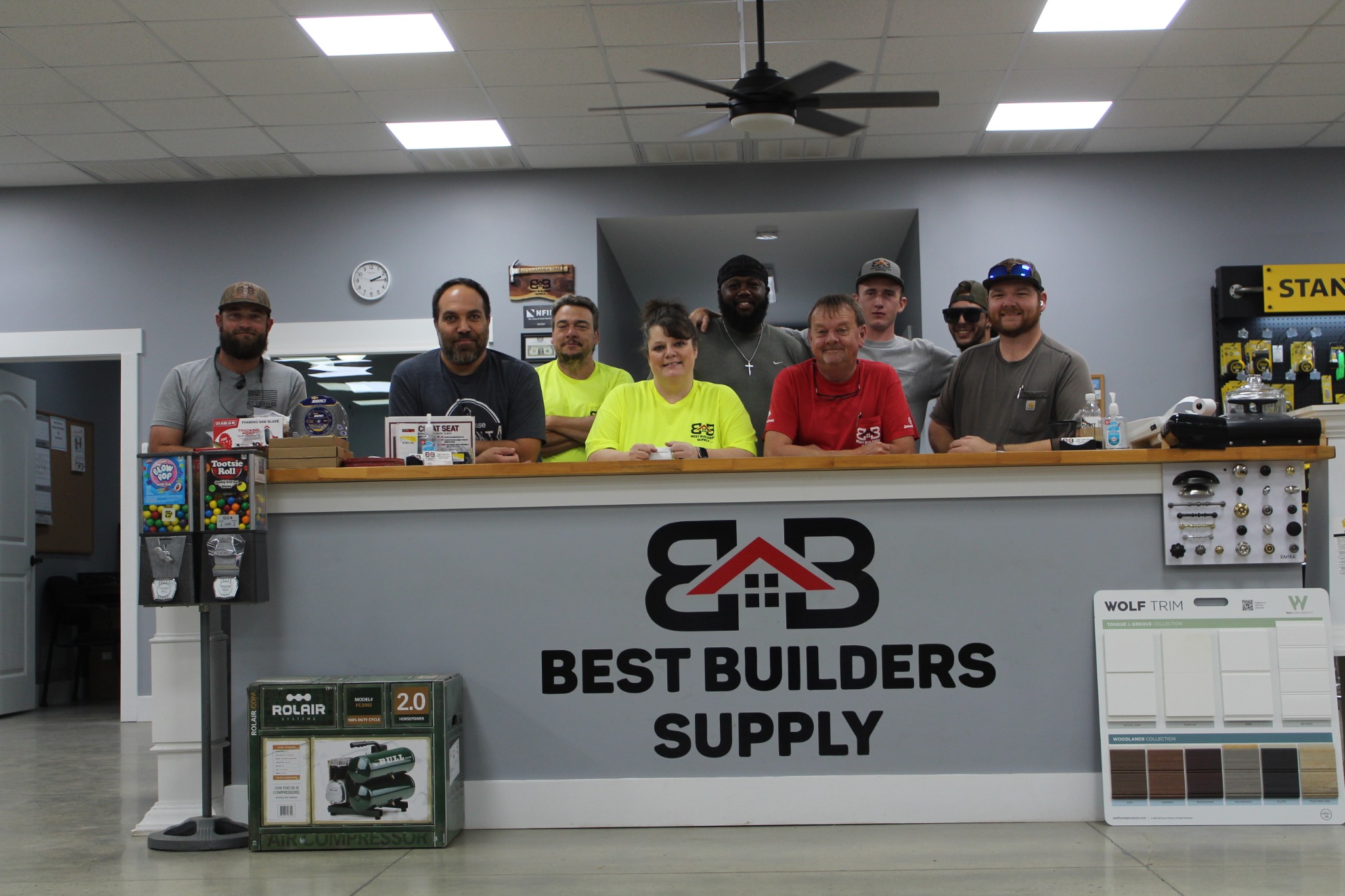 Best Builders Supply team gathered behind the sales counter